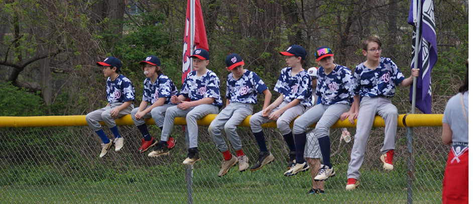 Sitting along the fence at opening day